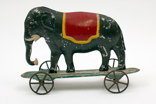Early American Antique Painted Tin Toy Elephant on Base with Wheels Early American Antique Painted Tin Toy Elephant on Base with Wheels