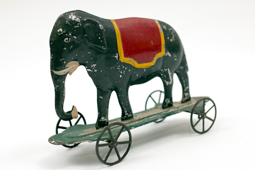 Early American Antique Painted Tin Toy Elephant on Base with Wheels Early American Antique Painted Tin Toy Elephant on Base with Wheels