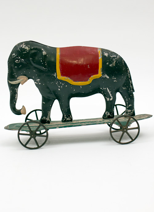 Early American Antique Painted Tin Toy Elephant on Base with Wheels Early American Antique Painted Tin Toy Elephant on Base with Wheels