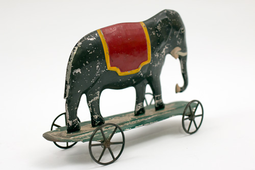 Early American Antique Painted Tin Toy Elephant on Base with Wheels Early American Antique Painted Tin Toy Elephant on Base with Wheels