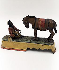 Antique Cast Iron Mechanical Bank Rare Yellow Base Variation Spise a Mule 19th Century Stevens Company for Sale
