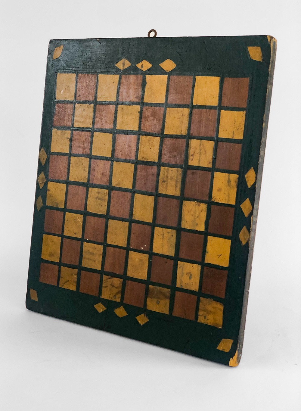 two color painted checkers gambeoard with gold diamond on green ground 
