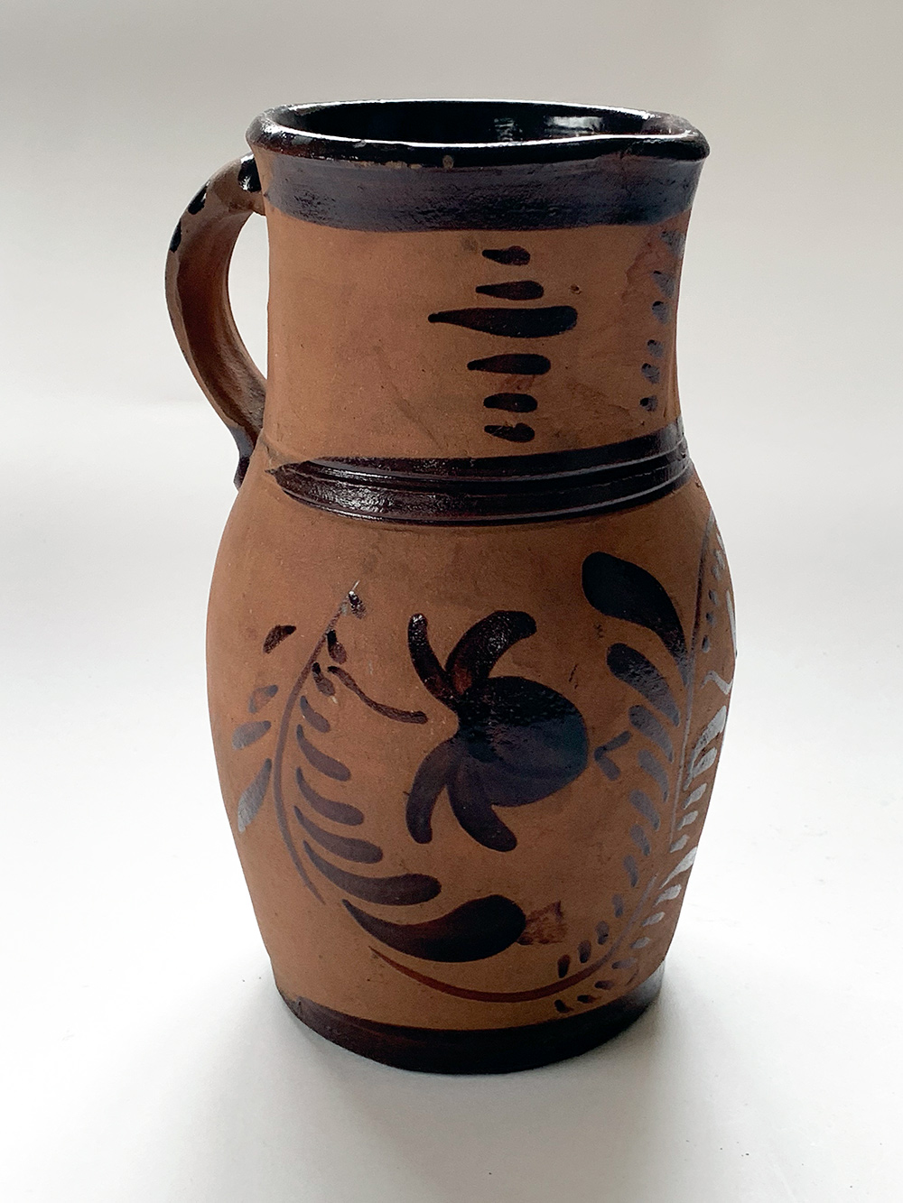 highly decorated pennsylvania tanware pitcher for sale