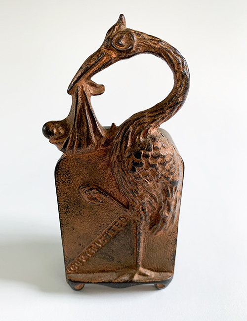 cast iron stork with baby penny bank