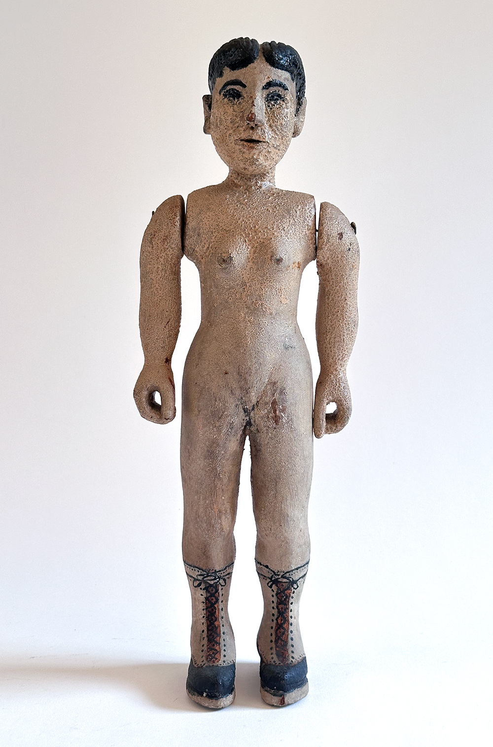 paint decorated wooden folk art carving of nude woman in boots