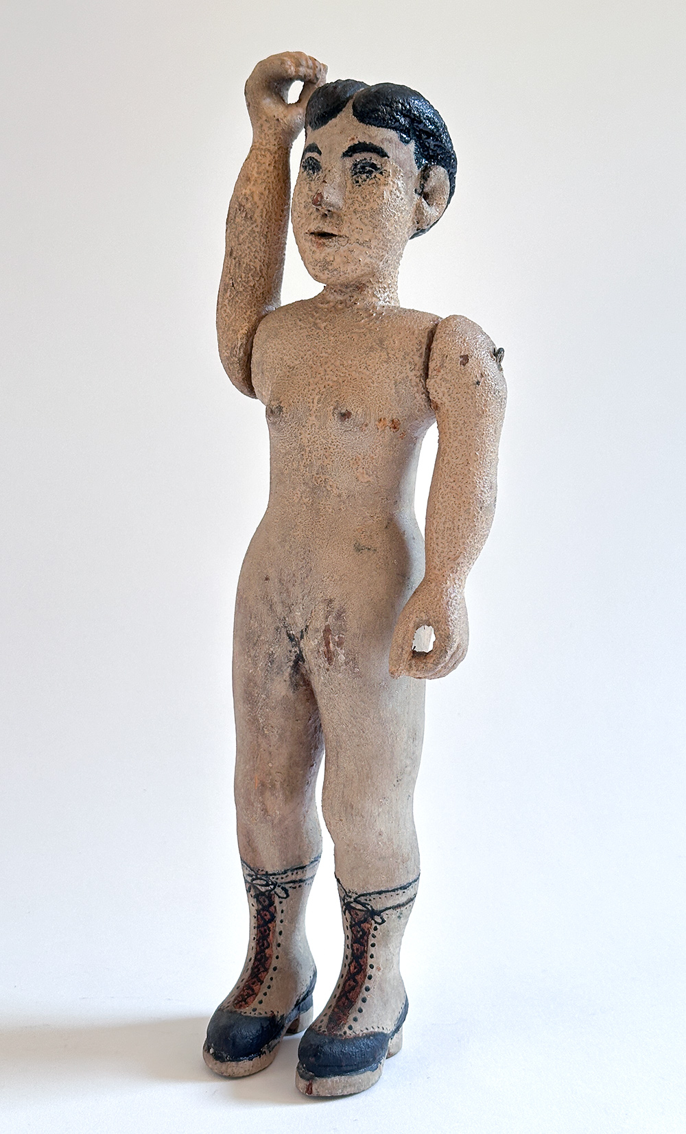 paint decorated wooden folk art carving of nude woman in boots