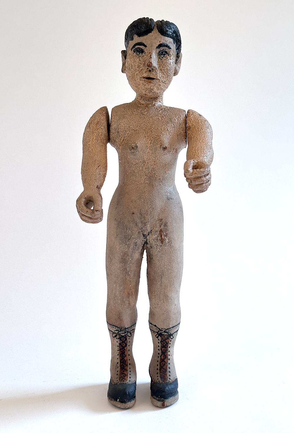 paint decorated wooden folk art carving of nude woman in boots