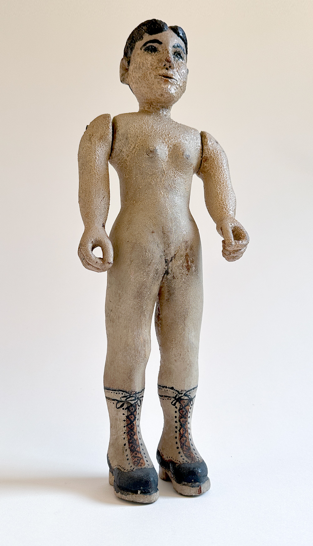 paint decorated wooden folk art carving of nude woman in boots