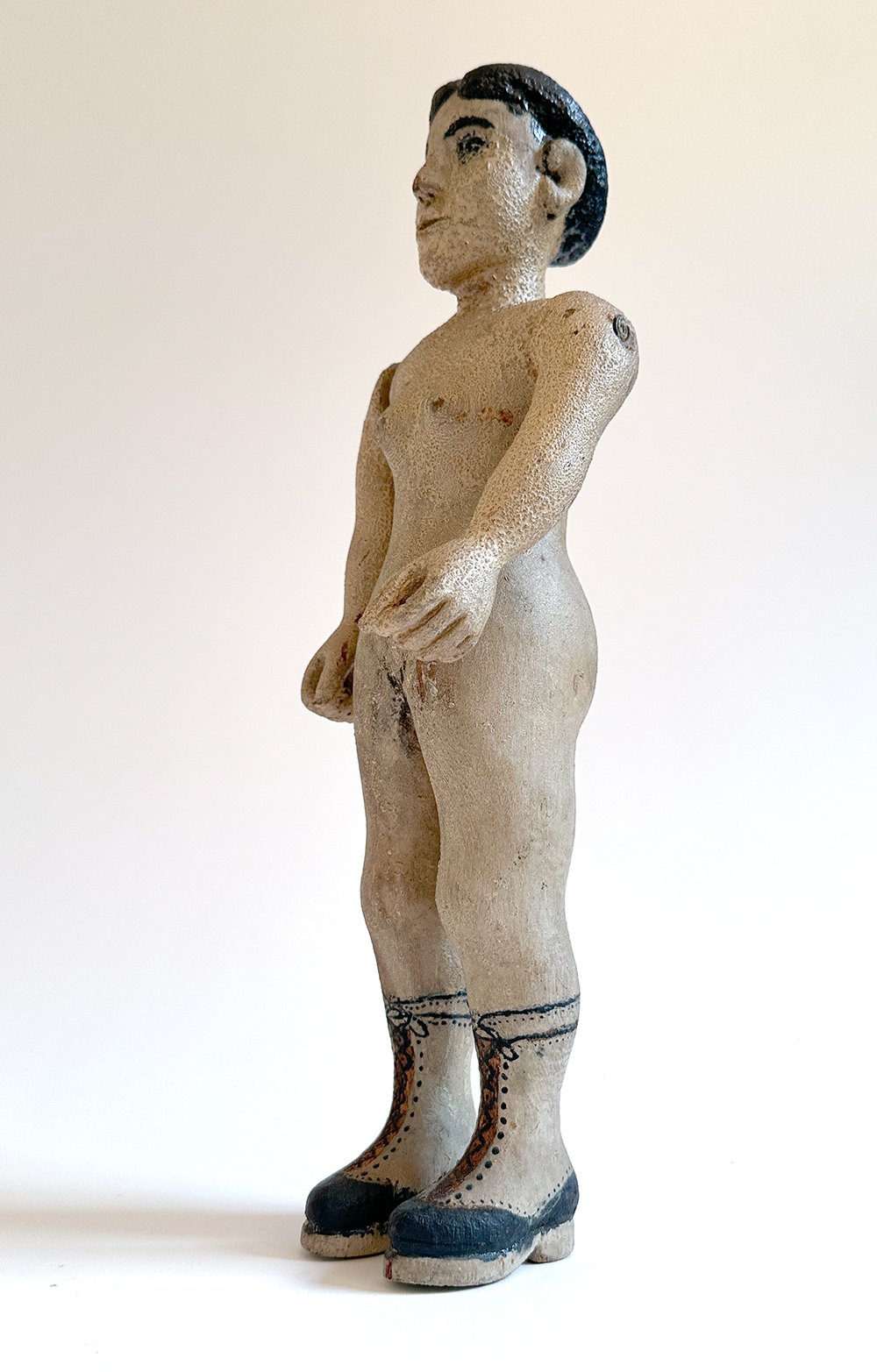 paint decorated wooden folk art carving of nude woman in boots