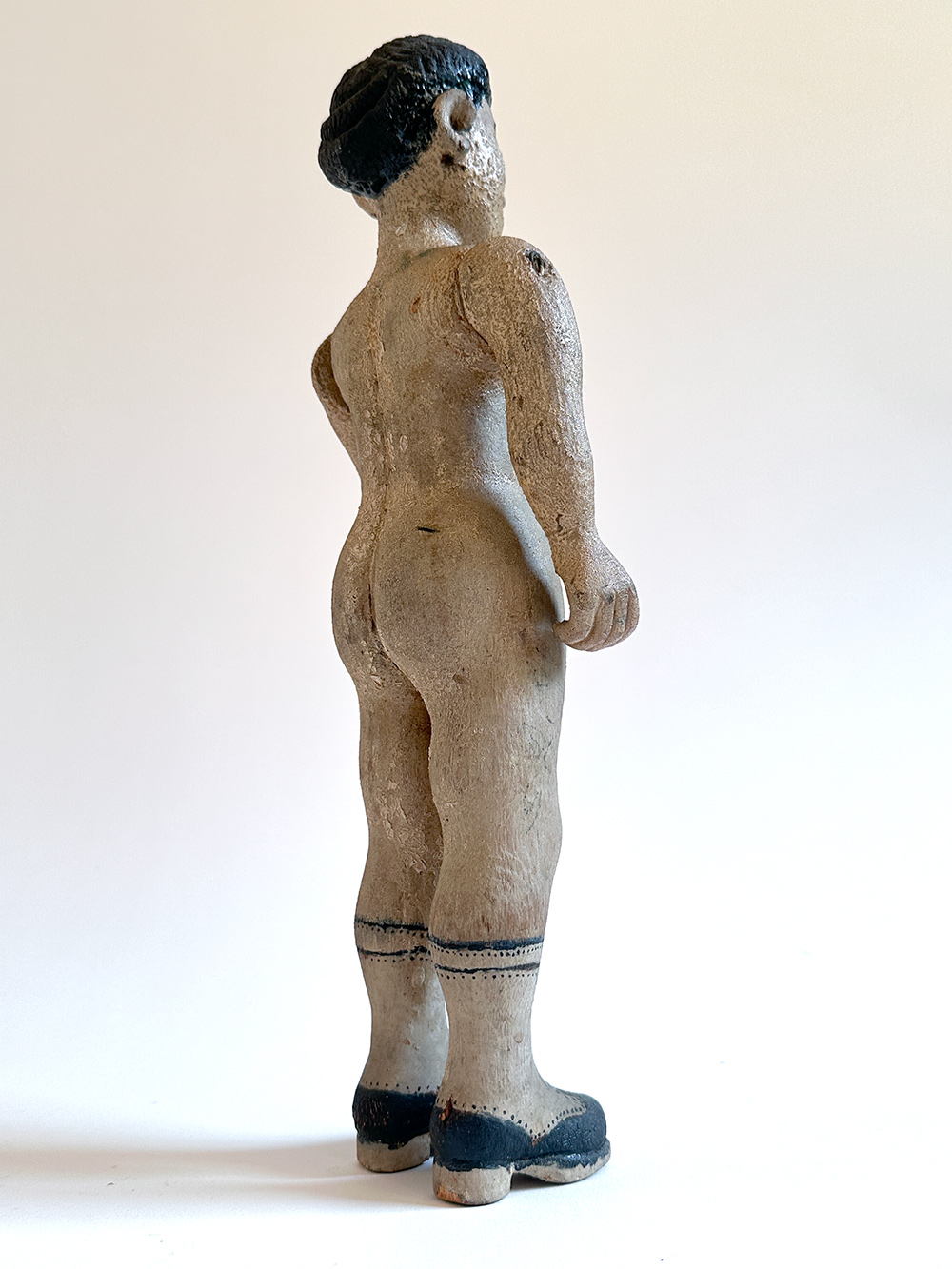 paint decorated wooden folk art carving of nude woman in boots
