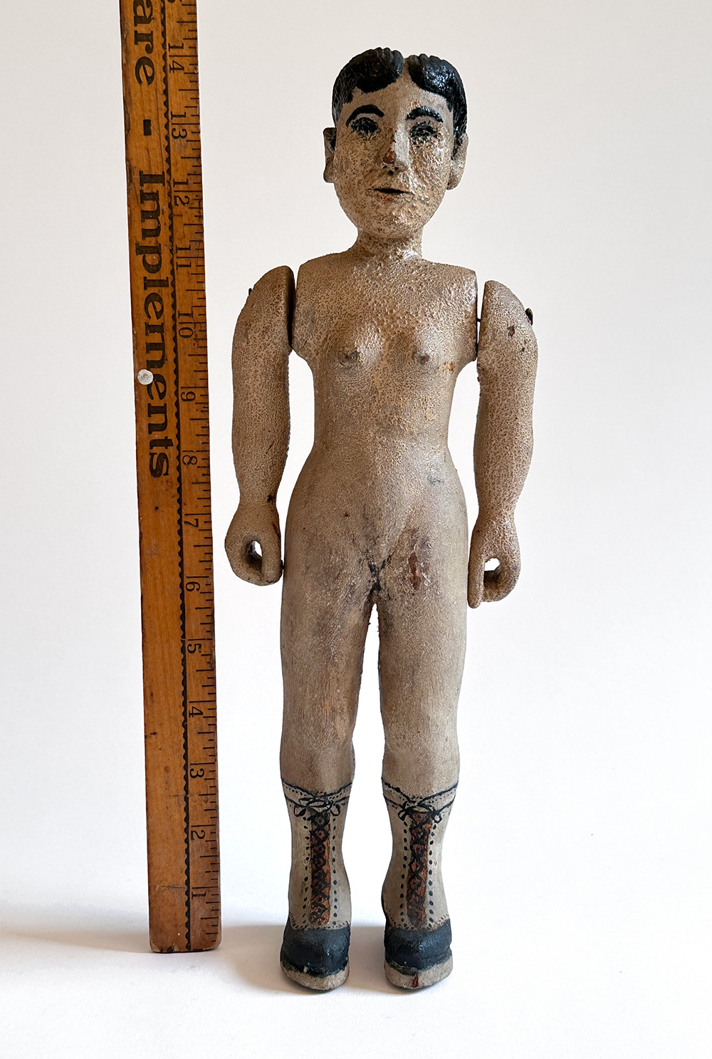 paint decorated wooden folk art carving of nude woman in boots