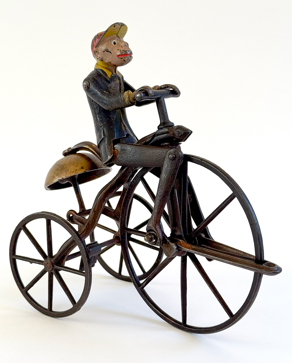 original j and e stevens cast iron deluxe painted and japanned monkey on tricycle bell toy