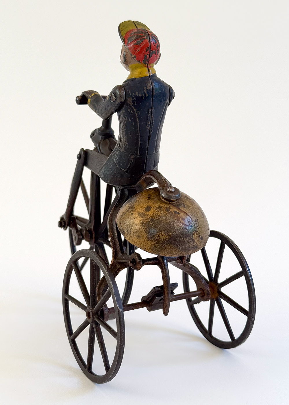 original j and e stevens cast iron deluxe painted and japanned monkey on tricycle bell toy
