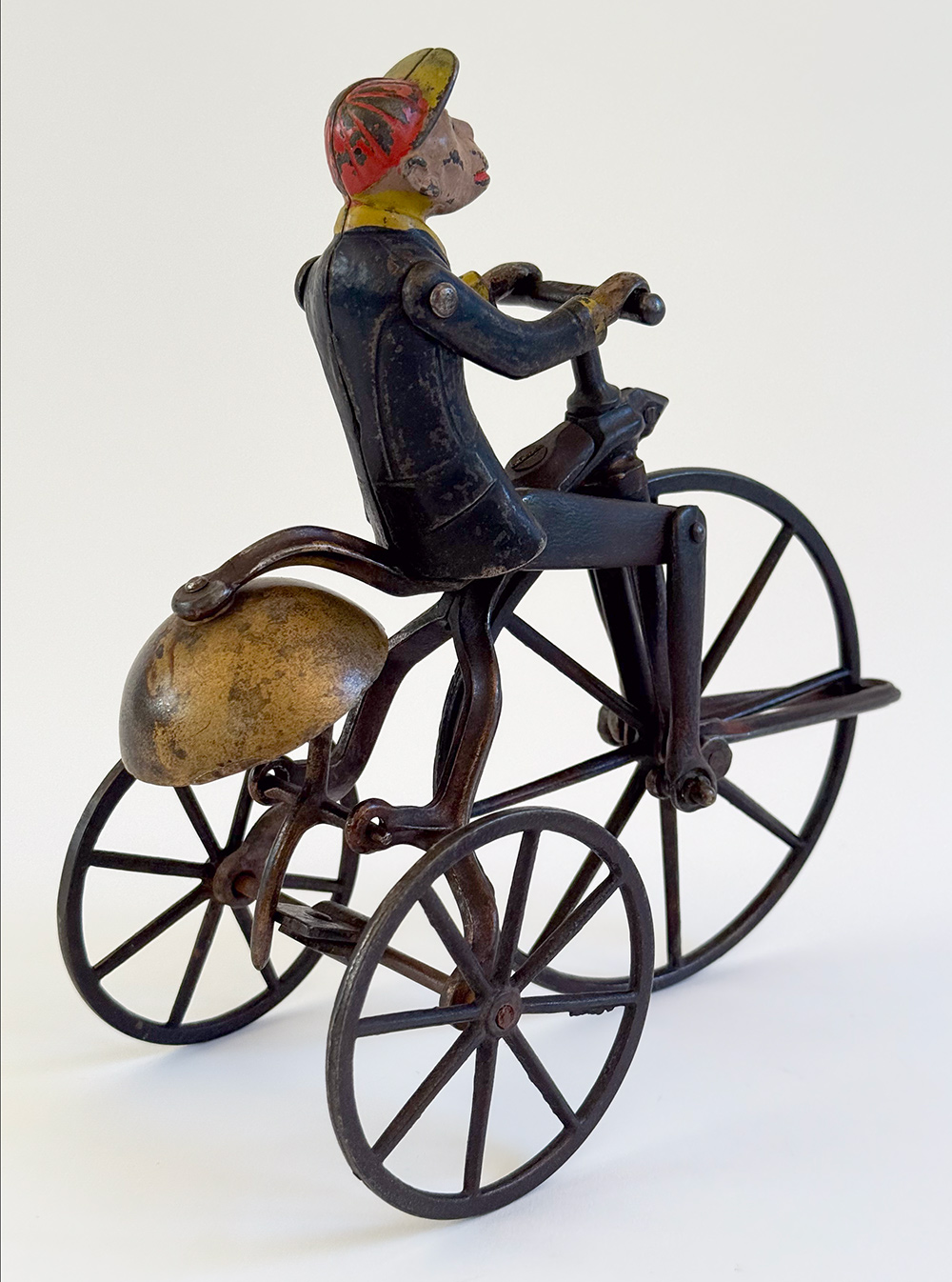 original j and e stevens cast iron deluxe painted and japanned monkey on tricycle bell toy