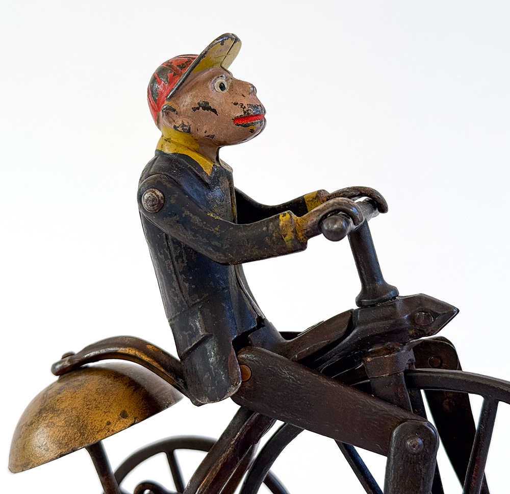 original j and e stevens cast iron deluxe painted and japanned monkey on tricycle bell toy