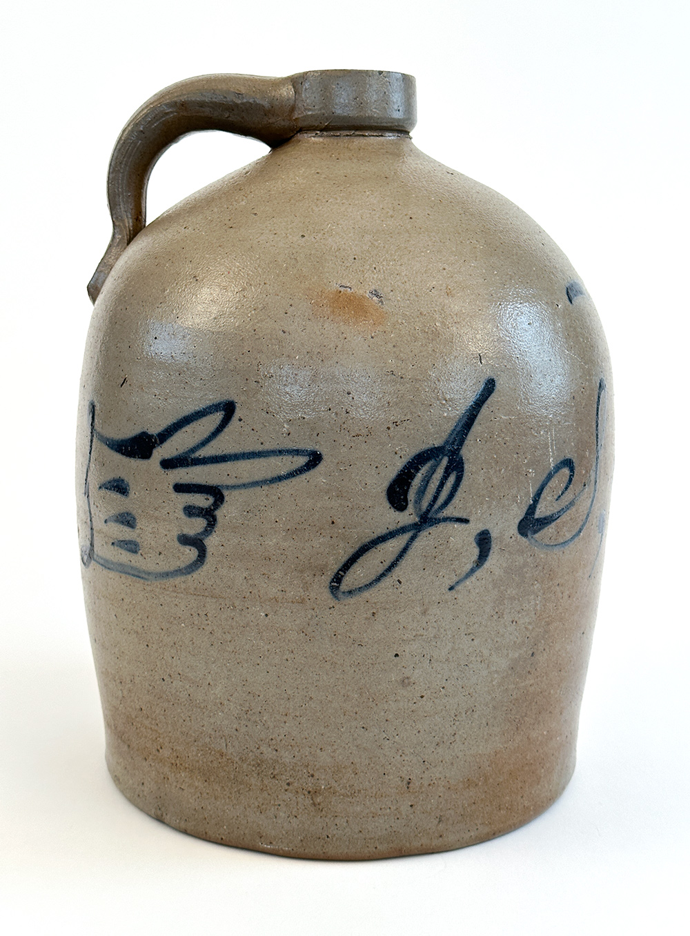 midwestern stoneware jug with folk art cobalt pointing hand decoration