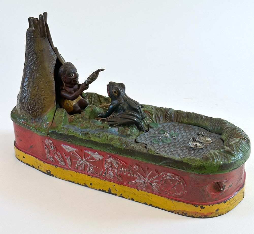 original cast iron chief big moon mechanical bank with scarce red base