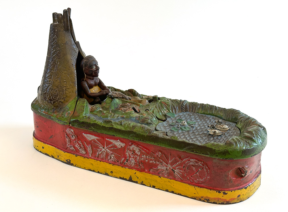 original cast iron chief big moon mechanical bank with scarce red base