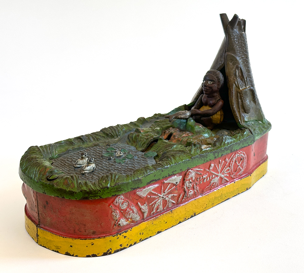 original cast iron chief big moon mechanical bank with scarce red base