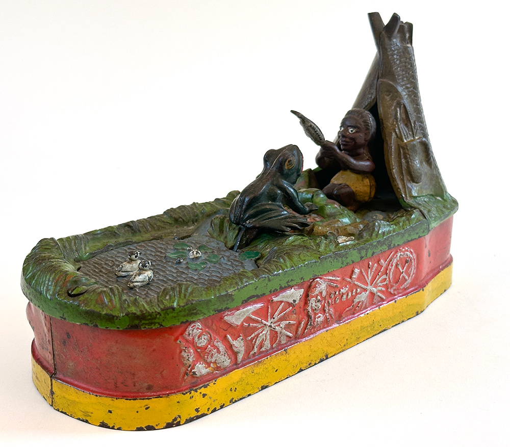 original cast iron chief big moon mechanical bank with scarce red base