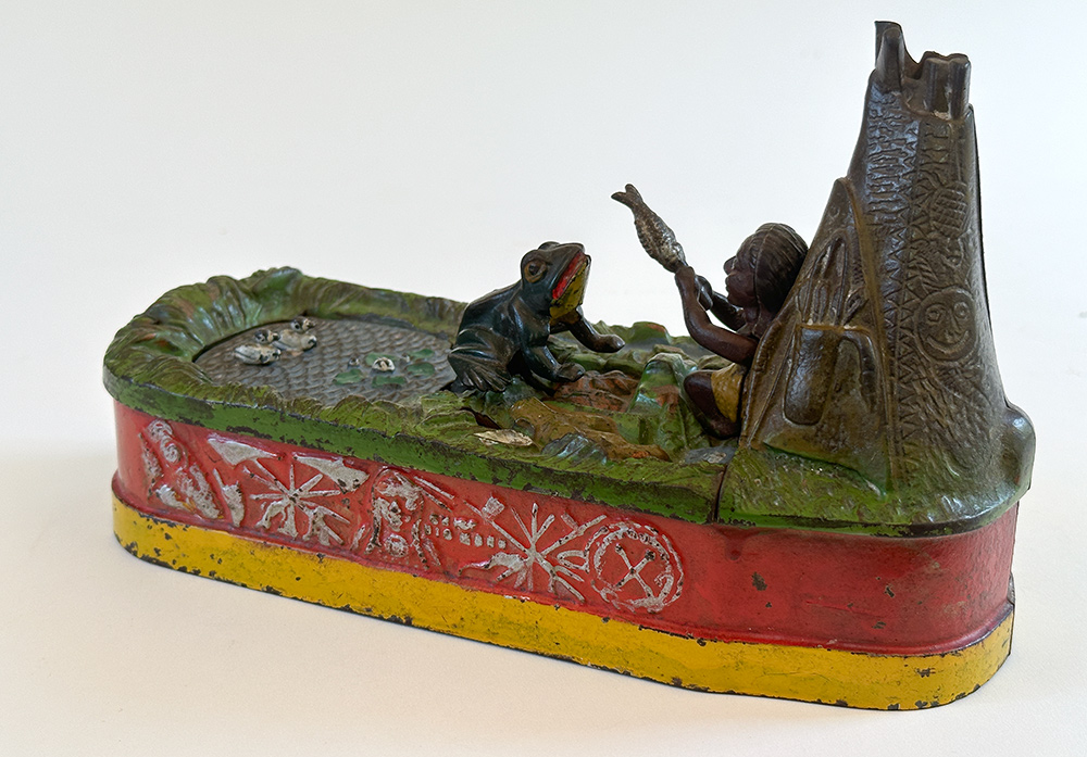 original cast iron chief big moon mechanical bank with scarce red base