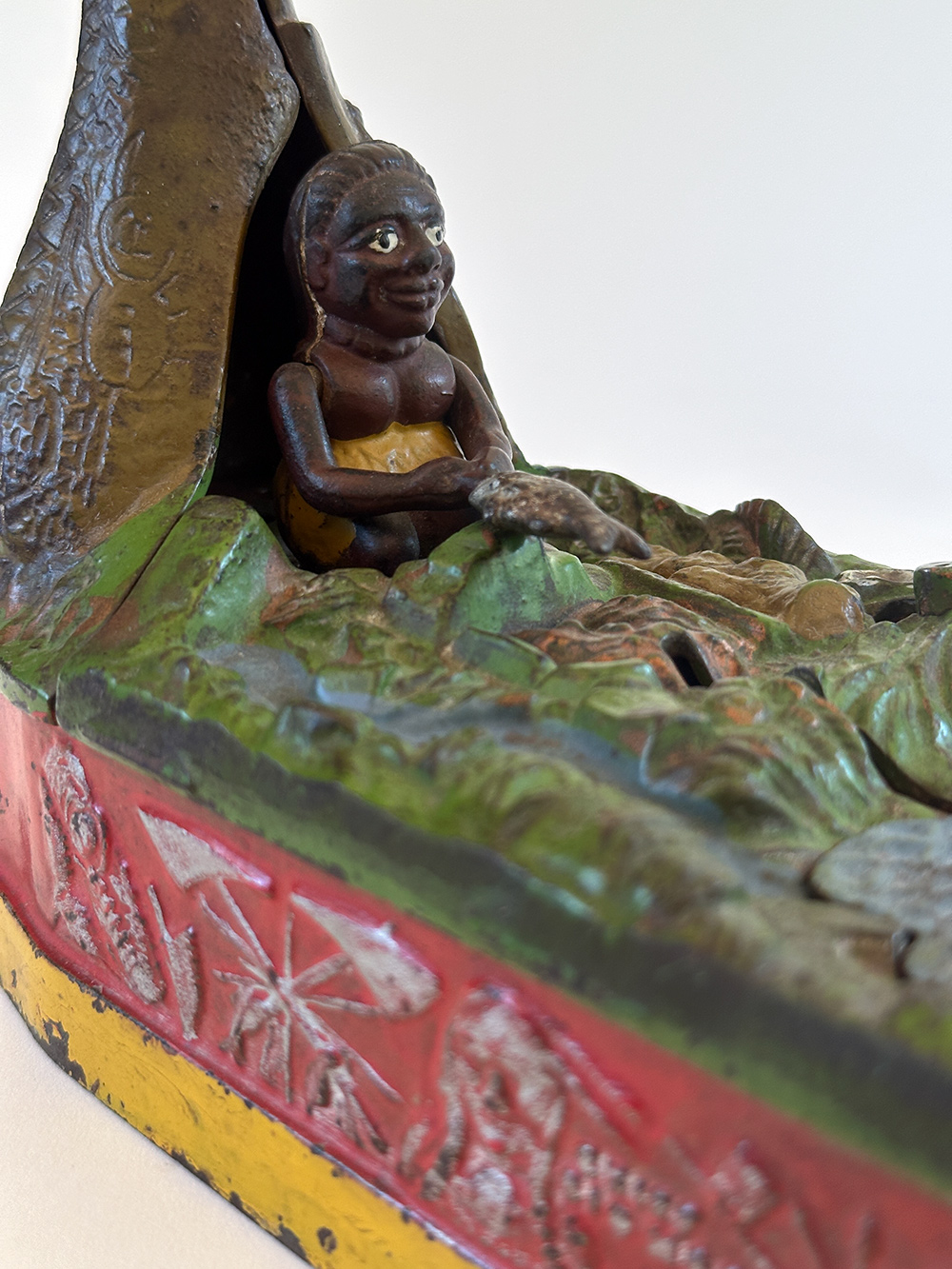 original cast iron chief big moon mechanical bank with scarce red base