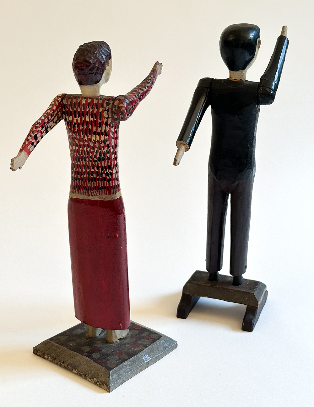 antique wooden original paint decorated carvings of a couple with articulated arms