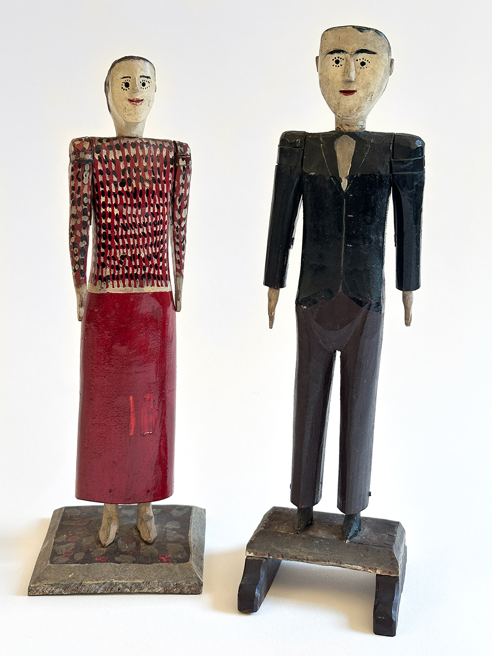 antique wooden original paint decorated carvings of a couple with articulated arms