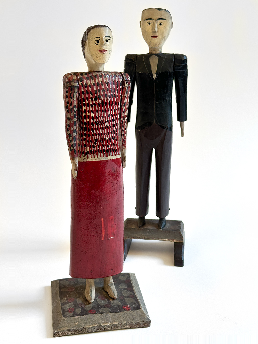 antique wooden original paint decorated carvings of a couple with articulated arms
