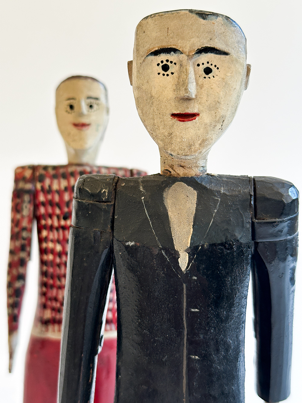 antique wooden original paint decorated carvings of a couple with articulated arms