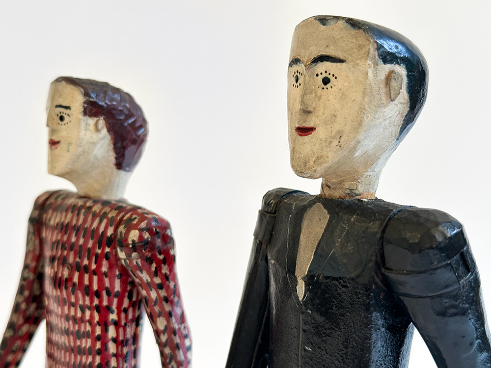 antique wooden original paint decorated carvings of a couple with articulated arms