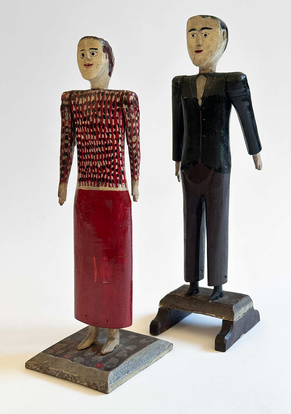 antique wooden original paint decorated carvings of a couple with articulated arms