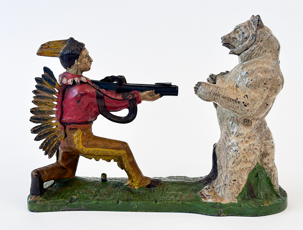 cast iron indian shooting bear mechanical bank with rare white bear