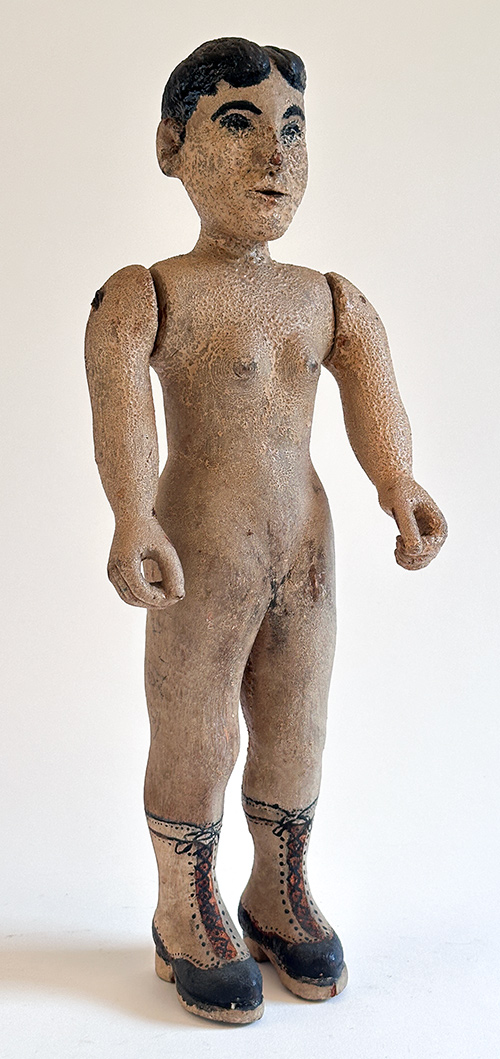 antique folk art carved nude woman with high top two tone boots and jointed arms