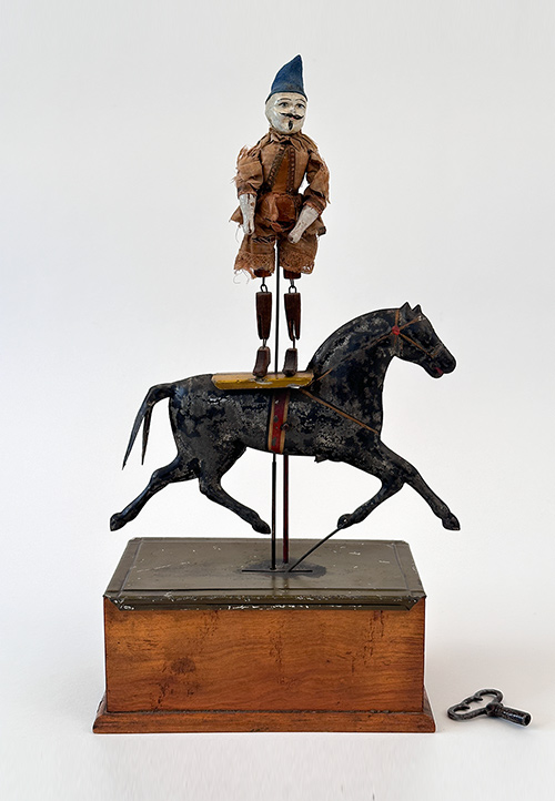 Early american windup ives clockwork circus rider on horse