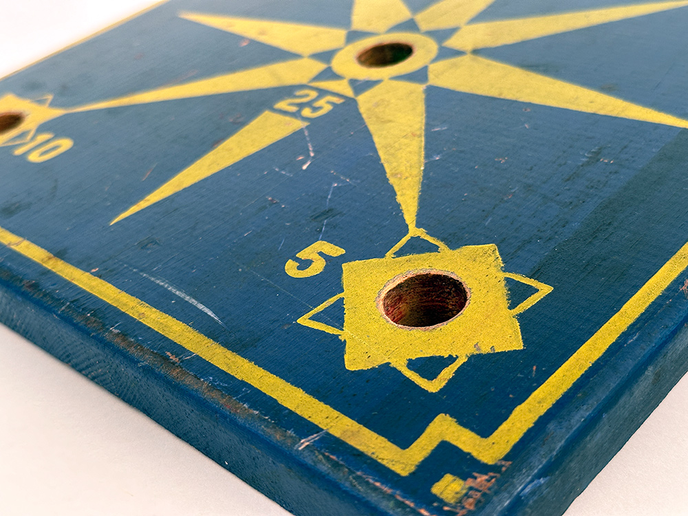 antique blue yellow paint decorated ring toss gameboard