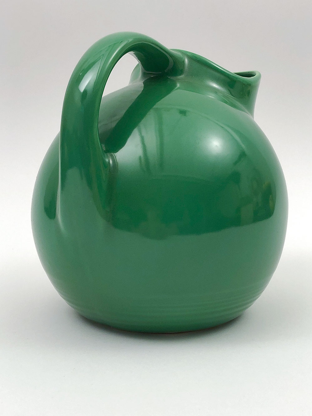 rare medium green harlequin water pitcher